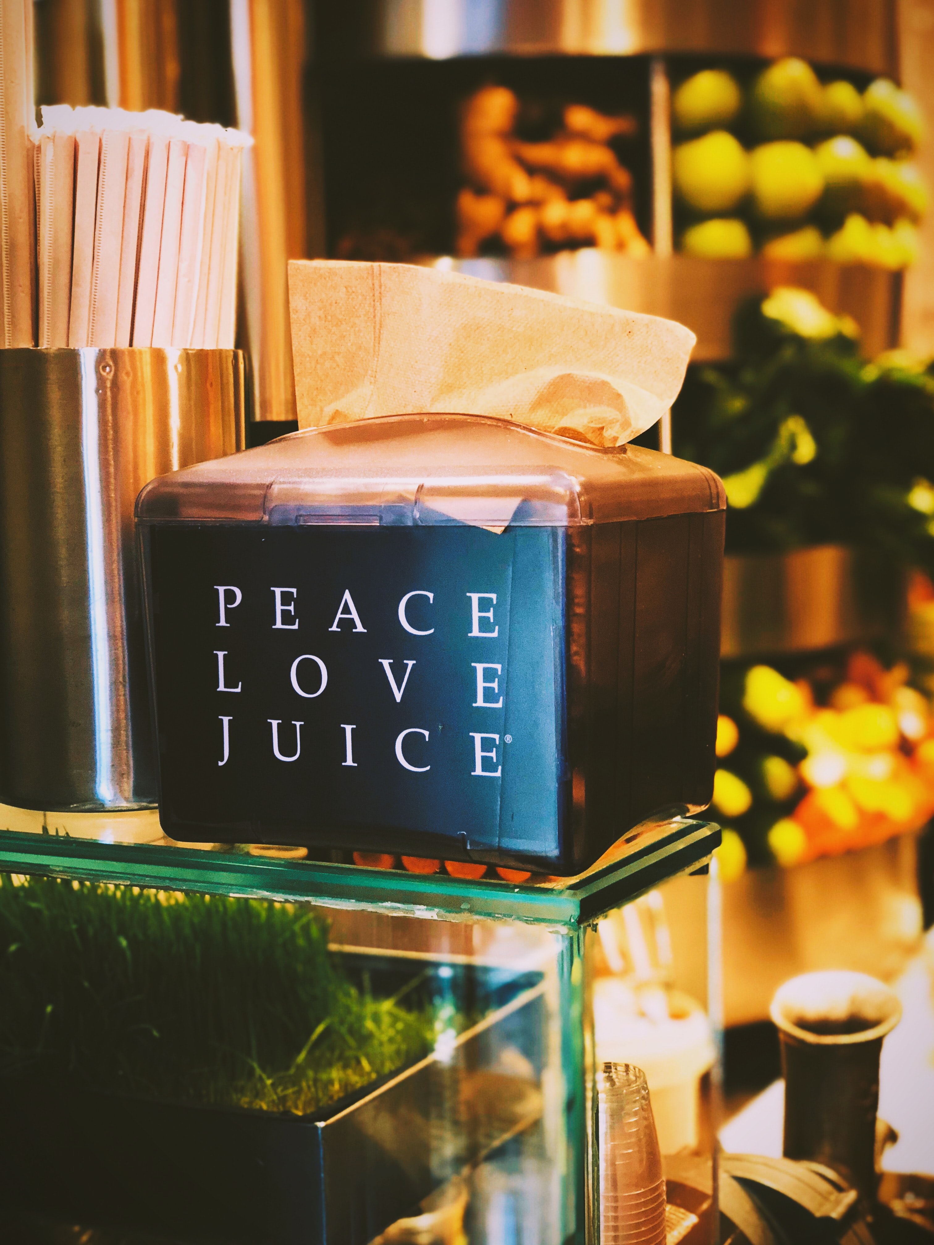 Peace Love Juice&rsquo; sign displayed on an ice box, adding a playful, upbeat note to the scene.